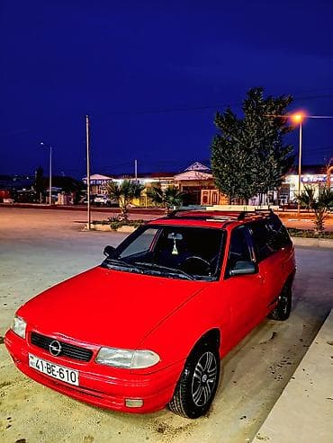 vaz 2107 maşını: Opel Astra F Caravan (universall) – qırmızı rəng. şəxsi sahibiyəm Heç — 8