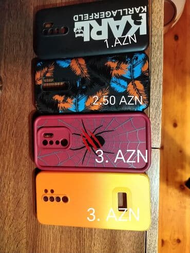 Kompüter, noutbuk və planşetlər: Müxtəlif dizayn və rənglərdə smartfon keysləri. Qara rəngli keysdə — 1