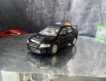 maşın modeli: Коллекционная модель Mitsubishi Lancer Evolution VII black 2002 — 1