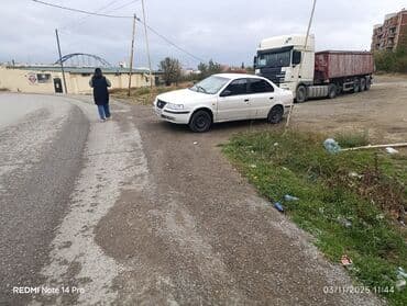 maşın adları: Ağ rəngli sedan – İran istehsalı Samand/Peugeot platformalı model — 1