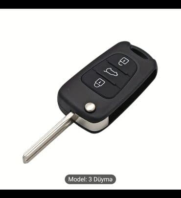 multi kar: Bu, üç düyməli qara rəngli avtomobil açarıdır. Açarda kilidləmə — 2