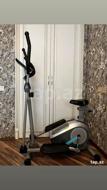 idman əlcəyi: Gimnastika üçün elliptik trenajor. Qolları hərəkət etdirən və — 1