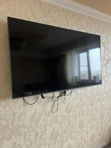 smart tv: Divara quraşdırılmış televizor - Təxmini ekran ölçüsü: 50–55 düym — 2