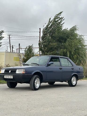 tofas mostu satilir: Model: Tofas Şahin/Doğan seriyası (sedan) Kuzov: 4 qapılı, tünd göy — 5