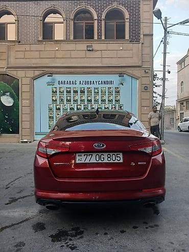 e39 radiator: Kia Optima sedan – qırmızı rəng - Kuzov: 4 qapılı sedan, idman üslublu — 4