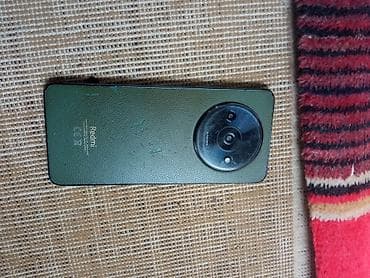 redmi a 7: Redmi smartfon - Model xətti: Redmi (dairəvi kamera modullu, yaşıl — 2