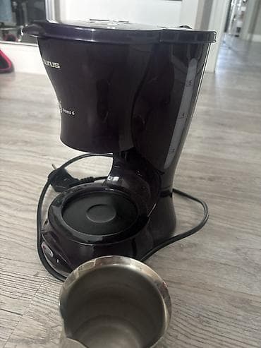 korpuslar: Taurus Aroma 6 elektrikli qəhvə aparatıdır. Kompakt masaüstü dizayn — 1