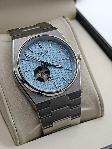 dini kartinkalar: Qol saatı, Tissot — 5