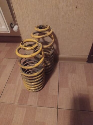 резиновые полики: Məhsul: Avtomobil üçün arxa/ön asqı yayları (2 ədəd) Rəng: Sarı — 1