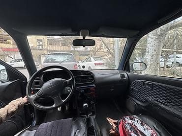 Продажа авто: Daihatsu Cuore, 3 qapılı hetçbek, tünd mavi rəng. Kompakt ölçü, şəhər — 4