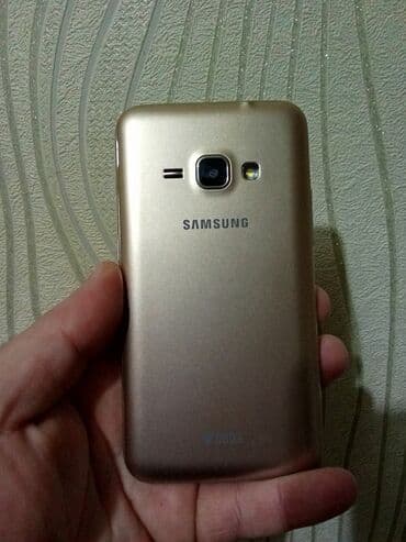 Автоэлектроника: Samsung Galaxy J1 2016, 8 ГБ, цвет - Золотой, Сенсорный, Две SIM карты — 2