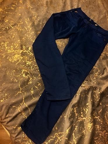 Tünd mavi rəngdə klassik şalvar - Model: düz kəsim, daralan balaq -