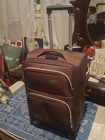 Şəkildə gördüyünüz qəhvəyi rəngdə çamadanı satıram. 20 kiloya qədər — 4