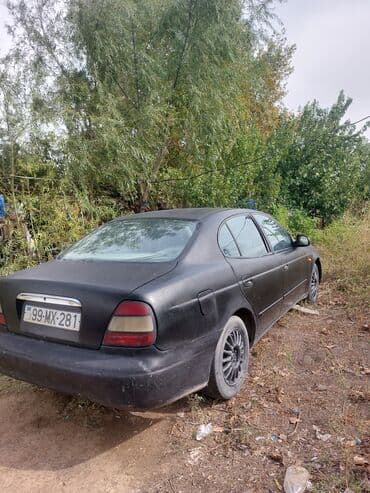 mersedes disk teker: Daewoo Leganza: 2 l | 1998 il Sedan — 1