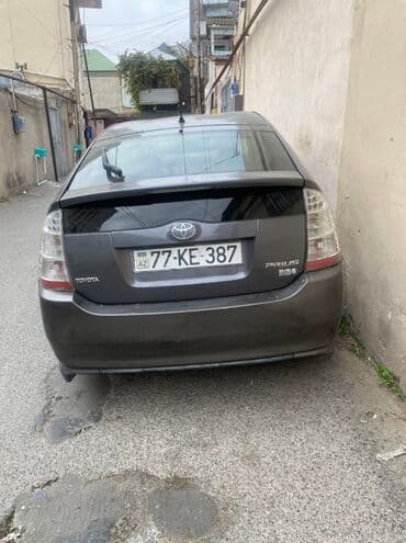 Digər nəqliyyat: Toyota Prius Hybrid – 5 qapılı liftbek, tünd boz rəng. - Hibrid — 2