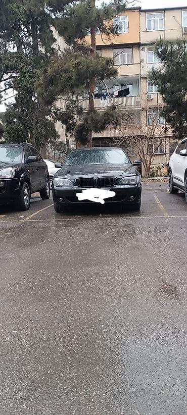 kia cerato 2010: BMW 7 series: 4.8 l | 2006 il Sedan — 10