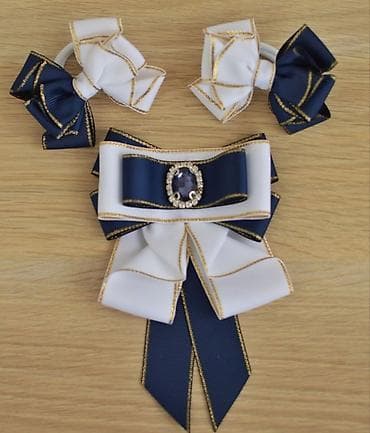 Sifarişlə hazirlanir.Oglanlara qalstuk qızlara bantik,abadok dəst