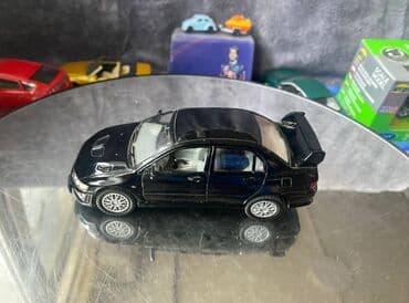 maşın modeli: Коллекционная модель Mitsubishi Lancer Evolution VII black 2002 — 11