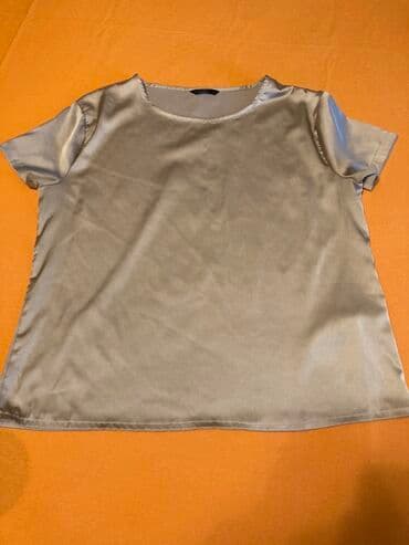 qarin eritmek ucun krem: Bu ağ rəngli, qolsuz bluz yaraşıqlı naxışlı dizayna malikdir. Bluzun — 4