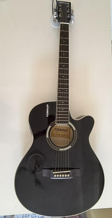 Freeman akustik gitara – kəsimli (cutaway) korpus dizaynı ilə
