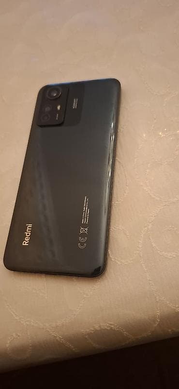 telefon aliram: Xiaomi Redmi smartfon - Model: Redmi (arka qapaqda Redmi loqosu). - — 1