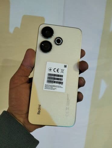 yeni model telefonlar: Xiaomi 13, 256 GB, rəng - Qızılı, 
 Sensor, Barmaq izi, İki sim kartlı — 2