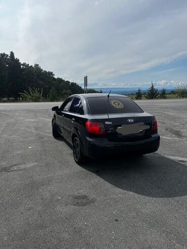 авто подлокотники: Kia Rio: 1.4 л | 2008 г. Седан — 2