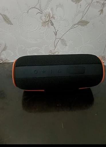 kalonka temiri: Daşınan Bluetooth akustik kolonkadır. Silindr formalı, qara rəngdə — 2