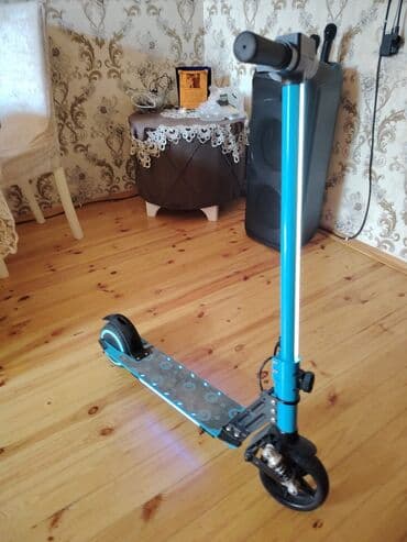 Elektrik skuter – mavi rəng Xüsusiyyətlər: - Ön amortizator sistemi