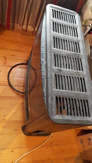 kombi qiymetleri sederek: Qaz sobası – narıncı/qarışıq naxışlı ön panel, üst hissədə geniş hava — 1