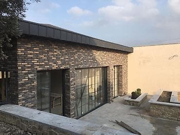 Fasad üçün dekorativ daş üzlük – qaya fakturalı klinker panellər -