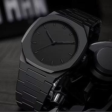 Qara rəngli minimalist dizayna malik kişi qol saatı. Hər stilə,Hər