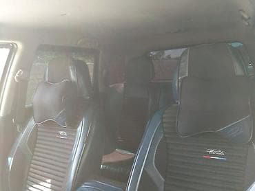 e39 radiator: Mitsubishi (Airtrek/Outlander ilk nəsil) krossover, ağ rəng. Xarici — 4