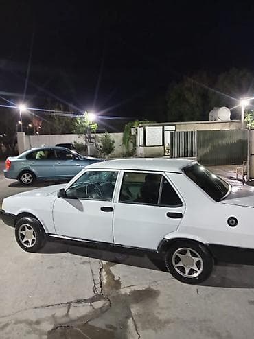 man sat: Model: Tofas (sedan) Kuzov: 4 qapılı, ağ rəng Sükan: solda Yanacaq — 5