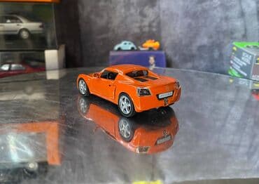 metbex tavan modelleri: Коллекционная модель Opel Speedster orange 2000 DeAgostini Art  — 8