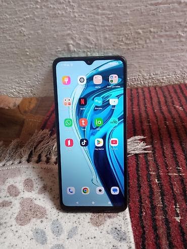 redmi a 7: Redmi smartfon - Model xətti: Redmi (dairəvi kamera modullu, yaşıl — 1
