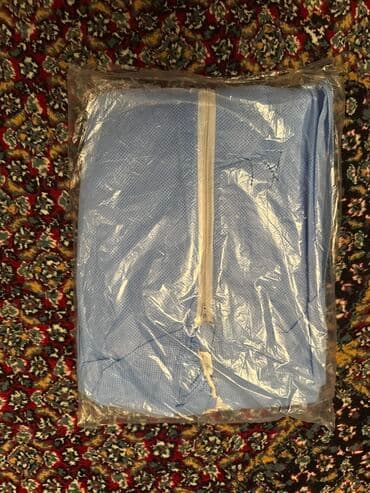 xüsusi iş geyimləri: Burada iki ədəd mavi rəngli, təkrar bağlana bilən qoruyucu kombinezon — 2