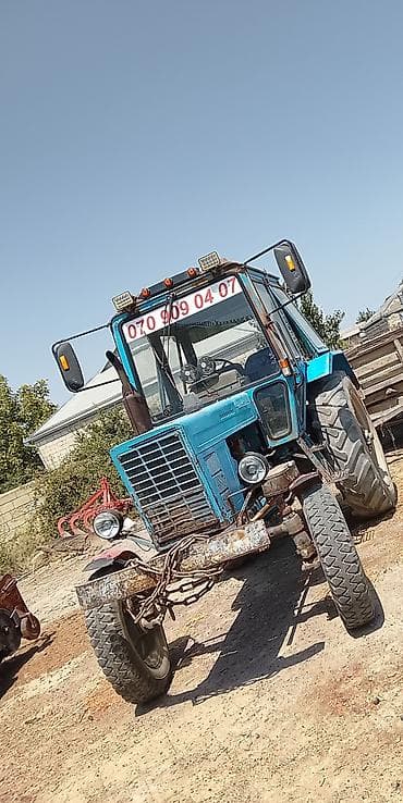 vaz 2106 ucuz: Mavi rəngli təkərli kənd təsərrüfatı traktoru. Texniki və funksional — 3