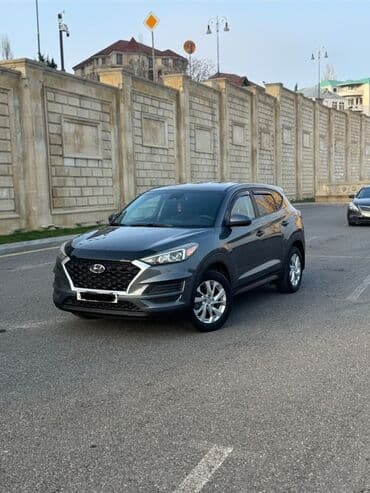 фольксваген тигуан 2 0: Tünd boz rəngdə olan Hyundai Tucson avtomobili. Bu avtomobil rahat — 2