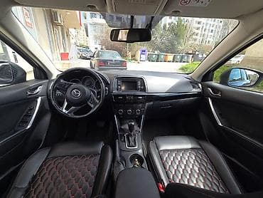 bmw x1 20d xdrive: Mazda CX-5: 2 l | 2014 il Krossover — 7