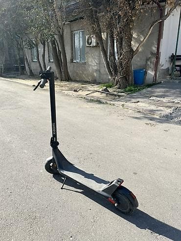 Tecili pul lazimdi Elektrik skuter – Udioryx (şaquli boruda loqo