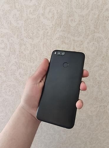 redmi mi a1: Xiaomi Mi A1, 64 GB, rəng - Qara, 
 Sensor, Barmaq izi, İki sim kartlı — 5