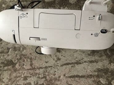 dərzi utusu: Tikiş maşını Derzi — 2