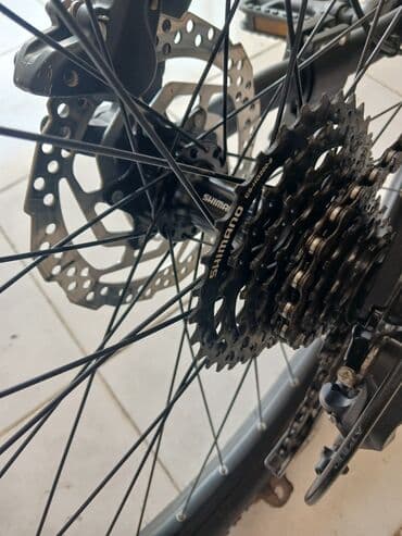 шоссейный велосипед trinx: Qara rəngli, Shimano Altus əyləc dəstəyi olan velosiped. Dəstək rahat — 6