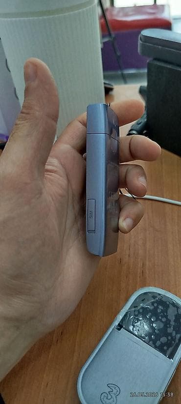 rx 7800 xt: Portativ mobil Wi‑Fi (MiFi) cihazı - Operator loqolu kompakt cib — 1