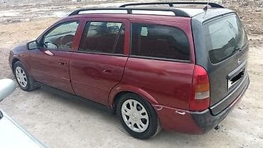 Opel Astra Caravan (Universal) – bordo rəng, geniş və praktik ailə