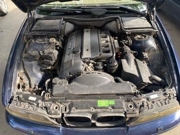 aston martin db7 5.9 at: BMW 5 series: 2.5 l | 2000 il Sedan — 3