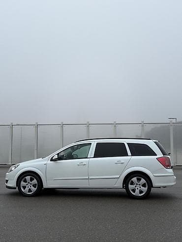 elektrikli moped: Opel Astra H Caravan (Universal), ağ rəng Texniki xüsusiyyətlər və — 6