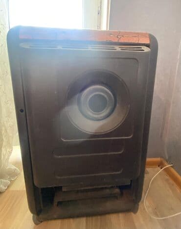 qızdırıcı konvektor: Qəhvəyi və qara rənglərdə dizayn edilmiş portativ qaz sobası. Kompakt — 3