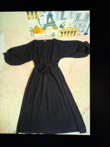 jaketler qadin ucun: Qara rəngli, uzunqol qadın donu ı. Bu don boyundan aşağıya doğru — 1